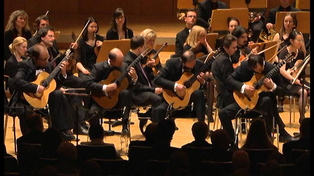 Poway Symphony Orchestra musicians rehearsing together